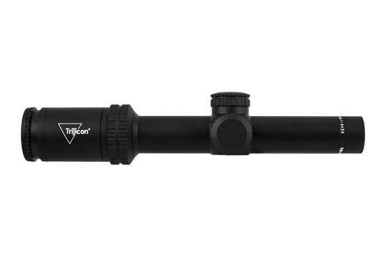 Trijicon 1-4x24mm Credo rifle scope features a 30mm tube and capped turrets with green illuminated MRAD ranging reticle.